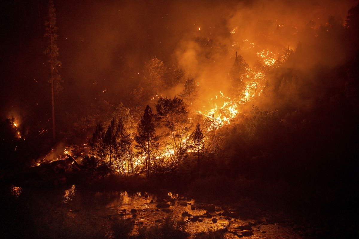 The Caldor Fire burns above the South Fork of the American River in the White Hall community of El Dorado County, Calif., on Friday, Aug. 27, 2021.  (Noah Berger)