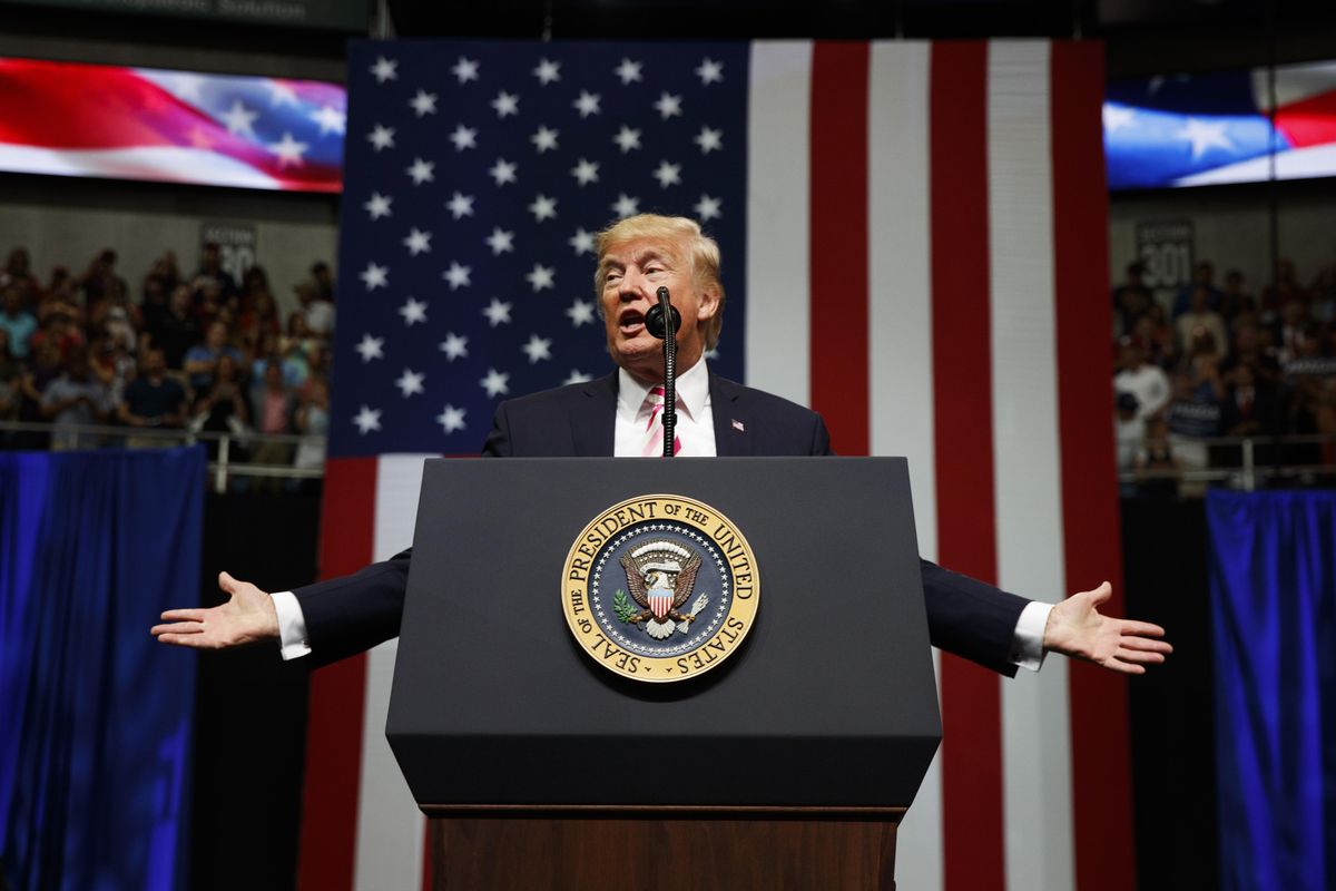 In this Friday, Sept. 22, 2017, file photo, President Donald Trump speaks at a campaign rally for Sen. Luther Strange, R-Ala., in Huntsville, Ala. Trump is expected to announce new restrictions on travel to the U.S. as his ban on visitors from six Muslim-majority countries sunsets Sunday, Sept. 24, 90 days after it went into effect. (Evan Vucci / Associated Press)