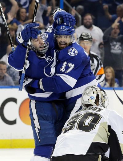 Tampa Bay Lightning's Tyler Johnson, left, celebrates his goal with teammate Alex Killorn, center, during the second period of Game 4 of the NHL hockey Stanley Cup Eastern Conference finals Friday. (Chris O'Meara / Associated Press)