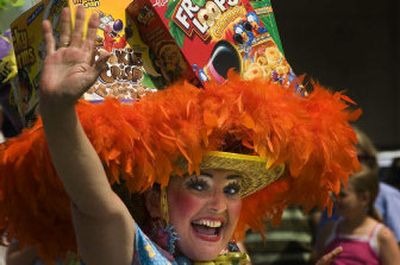 
The Red Hot Mamas dance and wave during the Post Falls Days parade on Saturday. 
 (Jed Conklin / The Spokesman-Review)