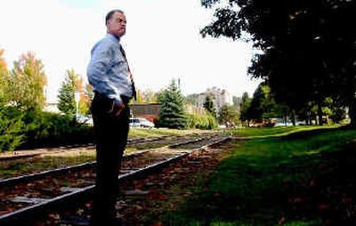 
City Attorney Mike Gridley stands nears a stretch of tracks slated for removal. 
 (Kathy Plonka / The Spokesman-Review)