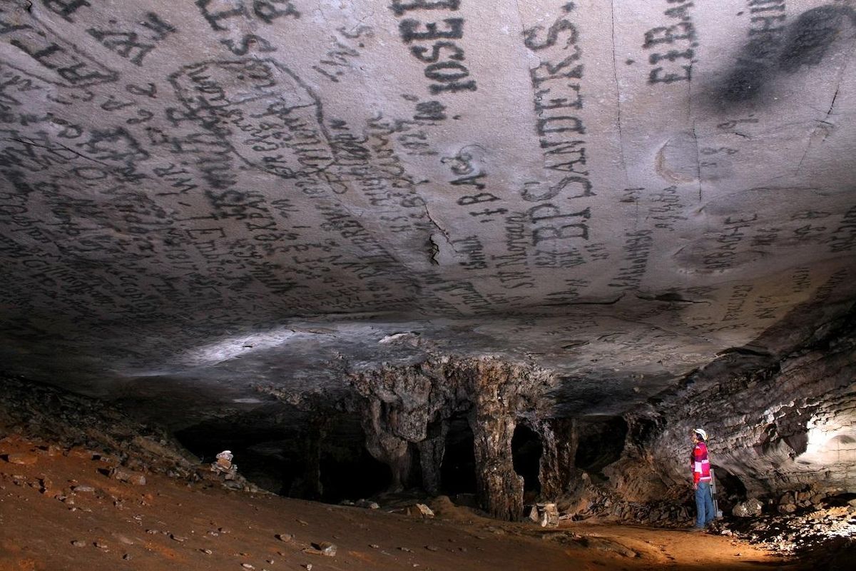 In a section of Mammoth Cave on the history-focused Gothic Avenue Tour, visitors can see centuries-old candle smoke graffiti overhead. (Jackie Wheet / Courtesy of National Park Service)