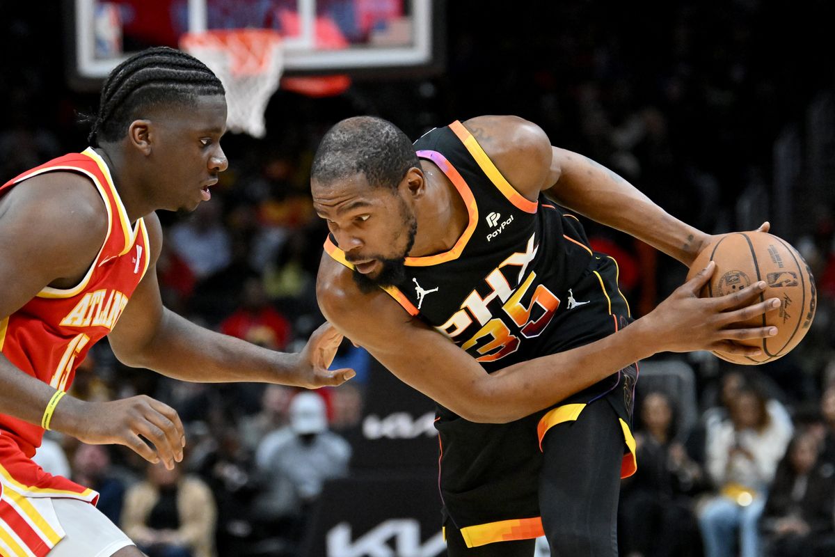 Atlanta Hawks center Clint Capela (15) attempts to steal the ball from Phoenix Suns forward Kevin Durant (35) during the second half.  (Tribune News Service)
