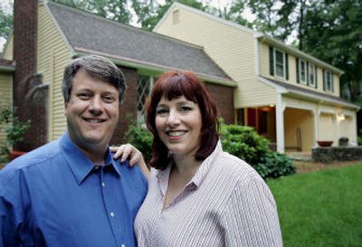 
Dennis O'Connor, left, and his wife Erika stand in front of their home in Wayland, Mass. Marriage can be more challenging the second time around and it's often money that creates the most difficulties. 
 (Associated Press / The Spokesman-Review)