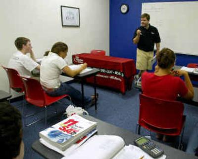 
A teacher prepares students for a new version of the SAT, to begin use in 2005, during a Princeton Review Workshop in Newton, Mass., earlier this month. 
 (Associated Press / The Spokesman-Review)