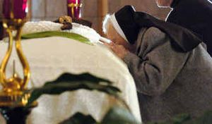 
Sister Jane Frances kisses the coffin of Mother Marianne Cope, after a Mass to honor Cope at the Franciscan Motherhouse Chapel Wednesday in Syracuse, N.Y.
 (Associated Press / The Spokesman-Review)
