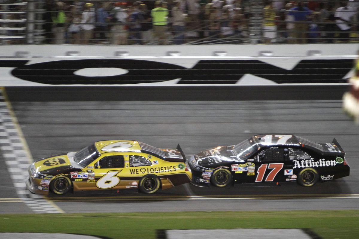 David Ragan (6) crosses the finish line ahead Matt Kenseth, who made sure his teammate didn’t go astray as he did in the Daytona 500. (Associated Press)
