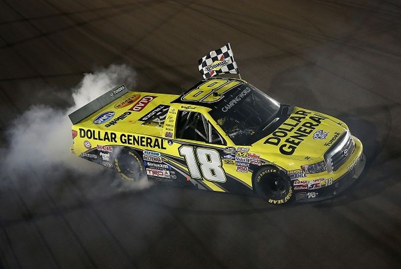 Brian Scott, driver of the #18 Dollar General Toyota, performs a burnout after winning the NASCAR Camping World Truck Series Lucas Oil 150 at Phoenix International Raceway on Nov. 9, 2012, in Avondale, Ariz. (Photo Credit: Christian Petersen/Getty Images) (Christian Petersen / Getty Images North America)