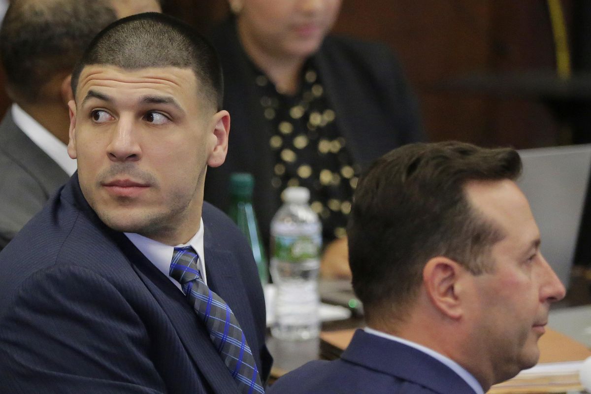 Former New England Patriots tight end Aaron Hernandez looks toward the gallery of the courtroom as the judge recesses proceedings for the lunch break during the first day of his double murder trial at Suffolk Superior Court Wednesday, March 1, 2017 in Boston. Hernandez is standing trial for the July 2012 killings of Daniel de Abreu and Safiro Furtado, who he encountered in a Boston nightclub. He is already serving a life sentence in the 2013 killing of semi-professional football player Odin Lloyd. (Stephan Savoia / Associated Press)