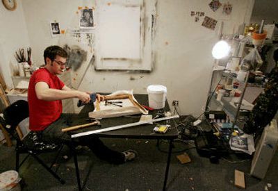 
Andrew Falkowski prepares a canvas for painting in the basement studio at his home in Lake Forest, Ill. A struggling artist, Falkowski and his wife have a combined five art degrees and six figures in debt because of them. 
 (Associated Press / The Spokesman-Review)