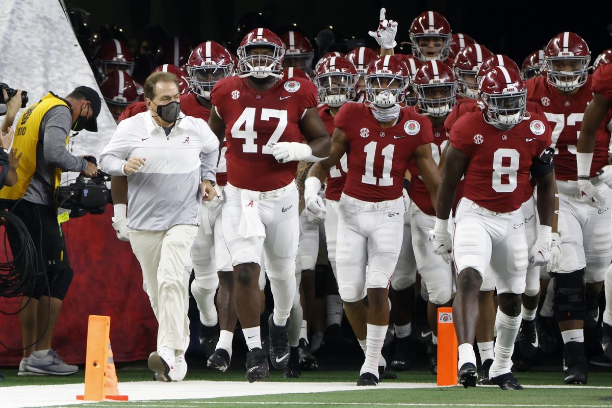 Alabama head coach Nick Saban, front left, jogs onto the field with his players for their Rose Bowl game against Notre Dame in Arlington, Texas, on Jan. 1.  (Ron Jenkins)