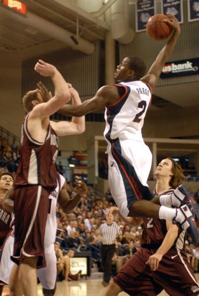 
Guard Jeremy Pargo leaps high and gets ready to throw down a monster dunk over Montana's Brian Qvale.
 (J. Bart Rayniak / The Spokesman-Review)