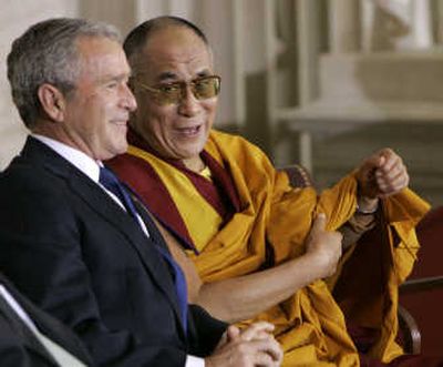 
President Bush chats with the Dalai Lama on Wednesday in the Capitol Rotunda during the Congressional Gold Medal ceremony. Associated Press
 (Associated Press / The Spokesman-Review)