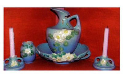 
These 1940s Roseville White Rose art pottery pieces are valuable to collectors.
 (The Spokesman-Review)