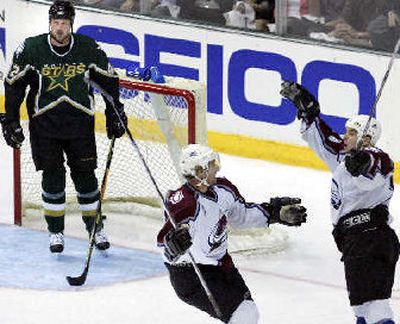 
Colorado's Wojtek Wolski, center, skates to Alex Tanguay after a second-period goal. Former Spokane Chief Jon Klemm is at left. 
 (Associated Press / The Spokesman-Review)