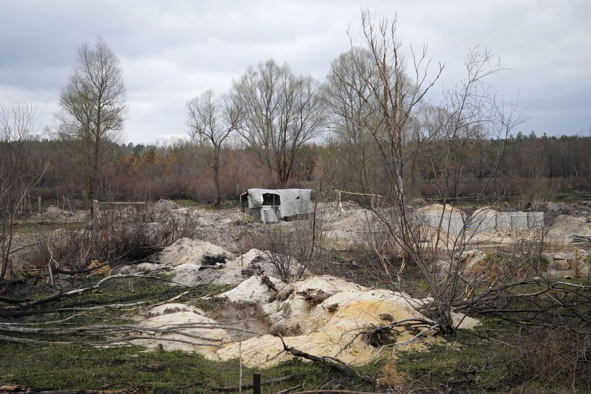 Trenches and firing positions sit in the highly radioactive soil adjacent to the Chernobyl nuclear power plant near Chernobyl, Ukraine, Saturday, April 16, 2022. Thousands of tanks and troops rumbled into the forested exclusion zone around the shuttered plant in the earliest hours of Russia’s invasion of Ukraine in February, churning up highly contaminated soil from the site of the 1986 accident that was the world