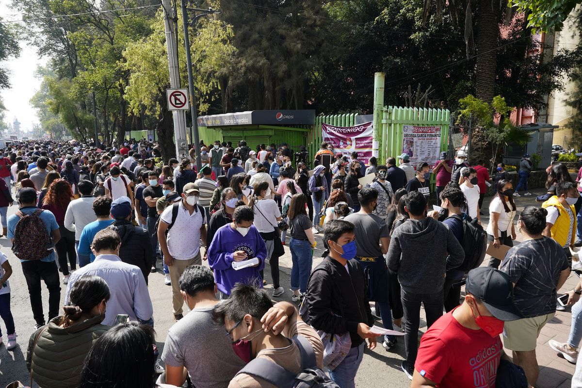 Residents wait in line to be vaccinated with a dose of the Pfizer COVID-19, during a vaccination drive for people between the ages of 18-29, in Mexico City, Thursday, Aug. 19, 2021.  (Eduardo Verdugo)