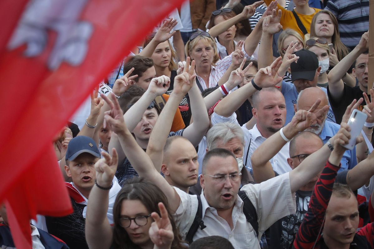 Belarusian opposition supporters shout slogans during a protest rally in front of the government building at Independent Square in Minsk, Belarus, Tuesday, Aug. 18, 2020. Workers at more state-controlled companies and factories took part in the strike that began the day before and has encompassed several truck and tractor factories, a huge potash factory that accounts for a fifth of the world