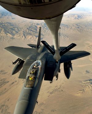 In a delicate dance between man and machine high above Afghanistan, an F-15E  Eagle tops off its tanks with jet fuel provided by a Fairchild Air Force Base 92nd Air Refuling Wing KC-135 Stratotanker on deployment at the Manas Transit Center in Kyrgyzstan. (Colin Mulvany / The Spokesman-Review)