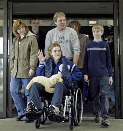 
Jeanna Giese, 15, waves as she leaves Children's Hospital with her family, Saturday in Milwaukee. 
 (Associated Press / The Spokesman-Review)