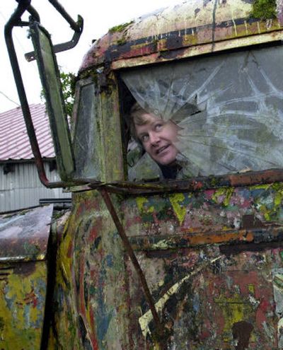 
Zane Kesey looks through the broken driver's side window of the 1939 International Harvester school bus his father, the late author Ken Kesey, rode into psychedelic history in 1964 with the Merry Pranksters. The Kesey family has agreed to allow the bus, stored in a swamp the past 15 years, to be restored. 
 (Associated Press / The Spokesman-Review)