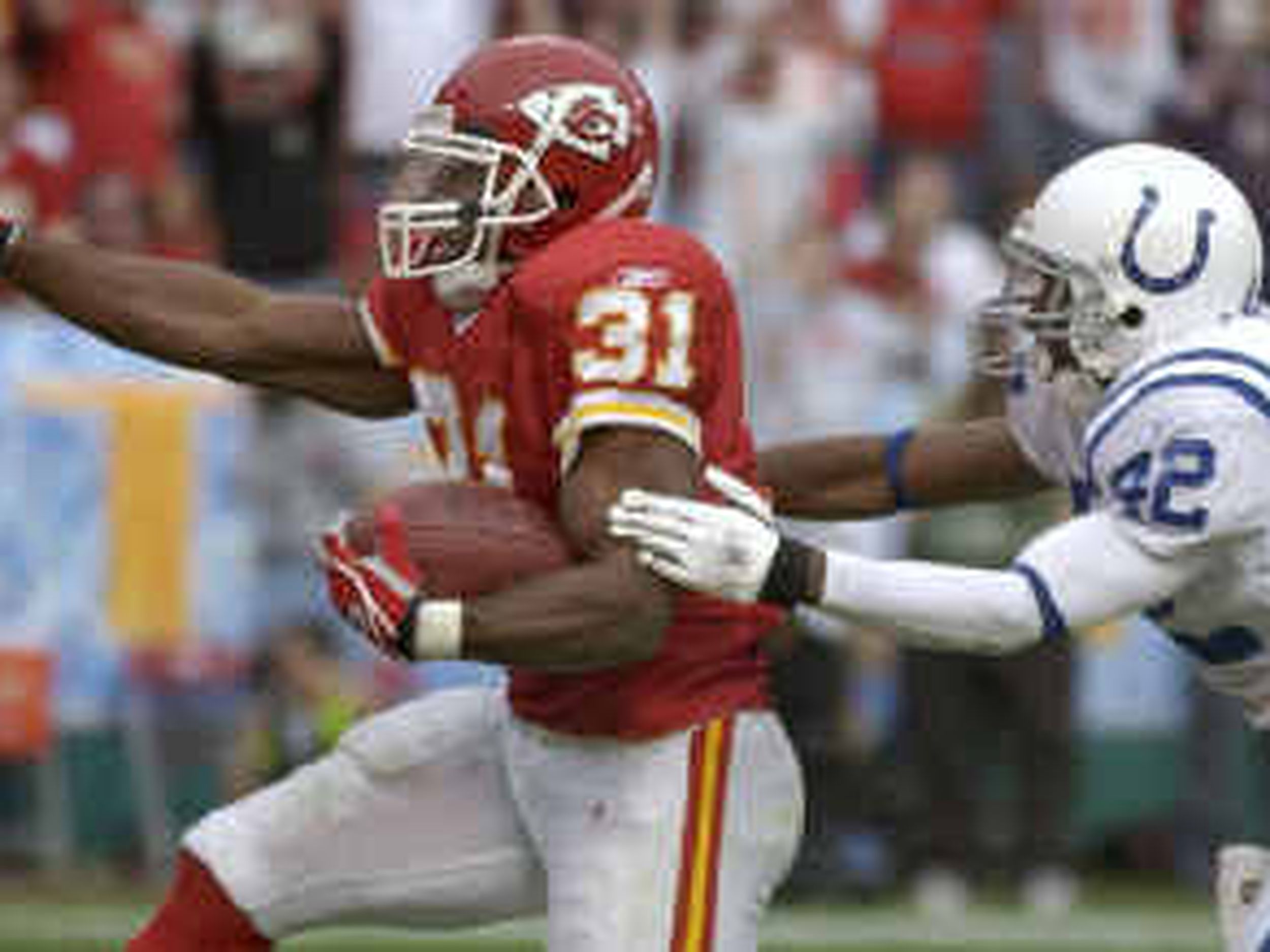 23 AUGUST 2004: Chiefs player Priest Holmes (31) runs the ball against the  Rams in Kansas City Chiefs win 24-7 over the St. Louis Rams at Arrowhead  Stadium in Kansas City, MO.