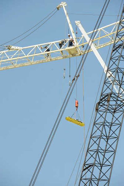 
A construction worker is lowered to the ground after he was crushed while dismantling a crane 200 feet in the air, on April 30 in Parole, Md.Associated Press
 (Associated Press / The Spokesman-Review)