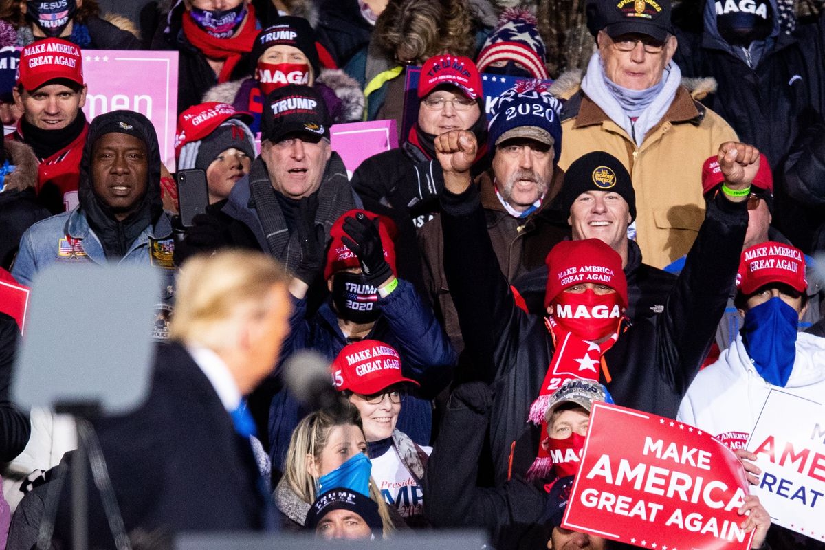 Supporters cheer as President Donald Trump speaks during a rally Tuesday, Oct. 27, 2020, in Omaha, Neb. Several people were taken to hospitals after the rally for President Trump that drew thousands, many of whom were left stranded miles from their parked cars in freezing weather.  (ANNA REED)