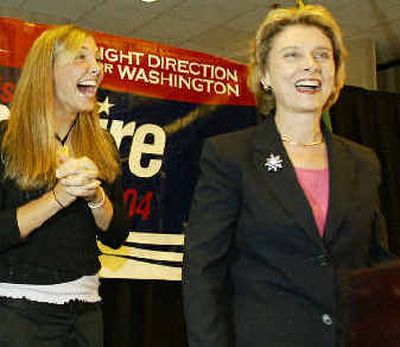 
Washington state Democratic gubernatorial hopeful Christine Gregoire, right, is cheered by her daughter, Michelle, left, as Gregoire greets a crowd of supporters shortly after the polls closed Tuesday. 
 (Associated Press / The Spokesman-Review)