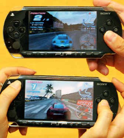 
When the PlayStation Portable arrives in North America later this month, consumers will be able to play video games, watch movies, listen to music and view photos on the black, book-sized device. 
 (Associated Press / The Spokesman-Review)