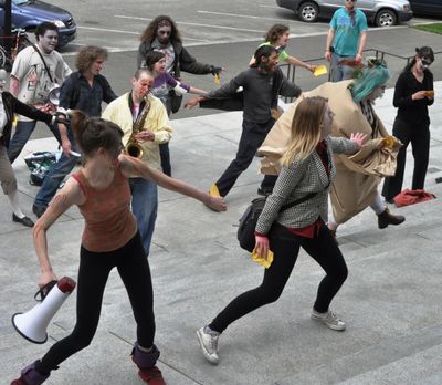 Protesters dressed as Zombies do a dance to protest budget cuts on the Capitol steps, May 13, 2011. (Jim Camden/The Spokesman-Review)