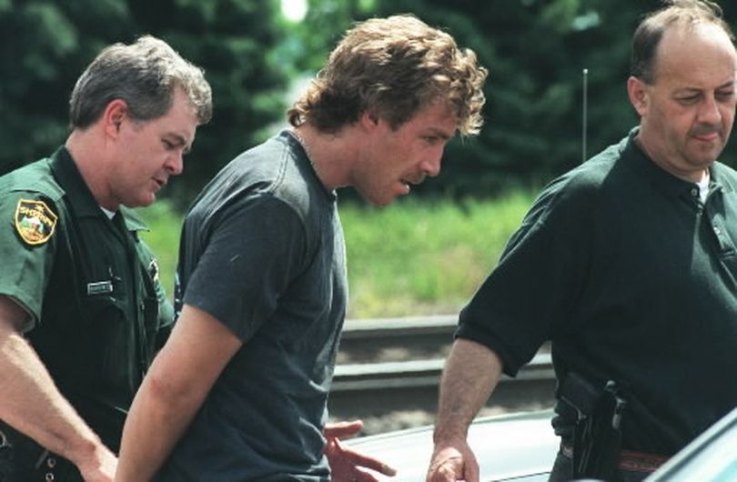  David Brewczynski, shown with Deputy Larry Humphreys and Detective Chuck Ellis when he was arrested in 1997, was released from prison in July. Brewczynski was arrested Tuesday for allegedly burglarizing a Valley duplex. 
 (File/ / The Spokesman-Review)