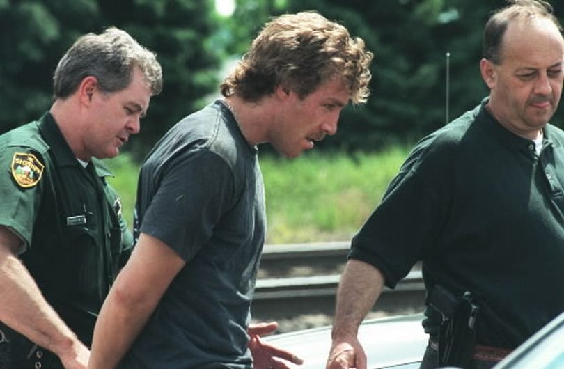  David Brewczynski, shown with Deputy Larry Humphreys and Detective Chuck Ellis when he was arrested in 1997, was released from prison in July. Brewczynski was arrested Tuesday for allegedly burglarizing a Valley duplex. 
 (File/ / The Spokesman-Review)