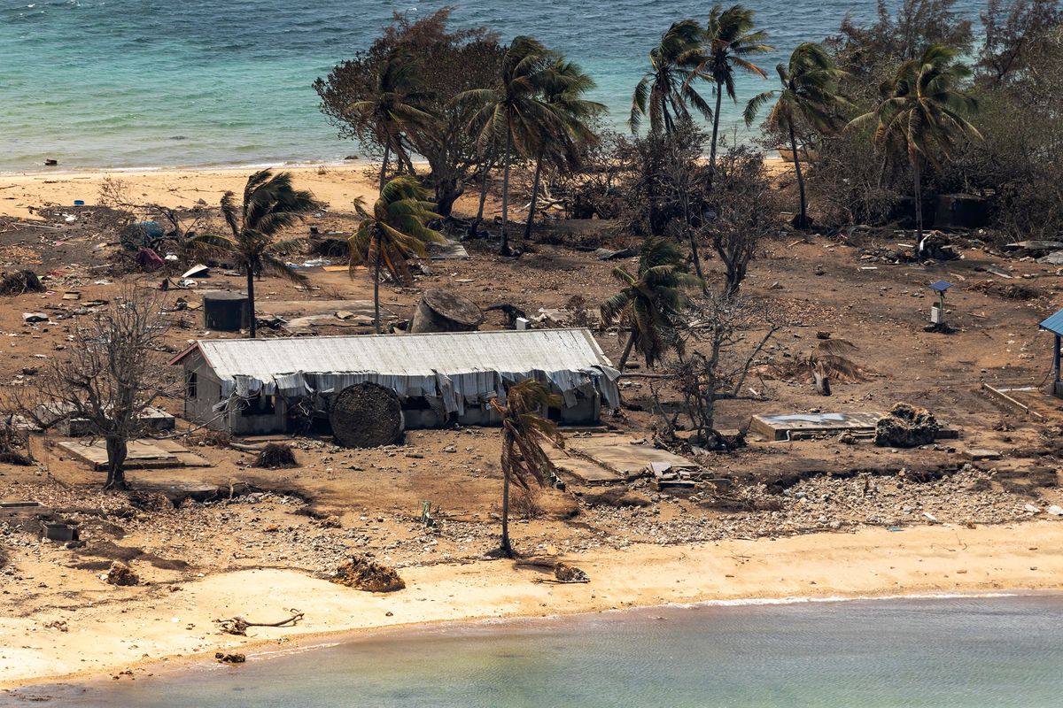 FILE - In this photo provided by the Australian Defense Force, debris from damaged building and trees are strewn around on Atata Island in Tonga on Jan. 28, 2022, following the eruption of an underwater volcano and subsequent tsunami. Coronavirus cases continue to rise rapidly in Tonga, and tests have confirmed that the particularly contagious omicron variant is behind the isolated Pacific island nation