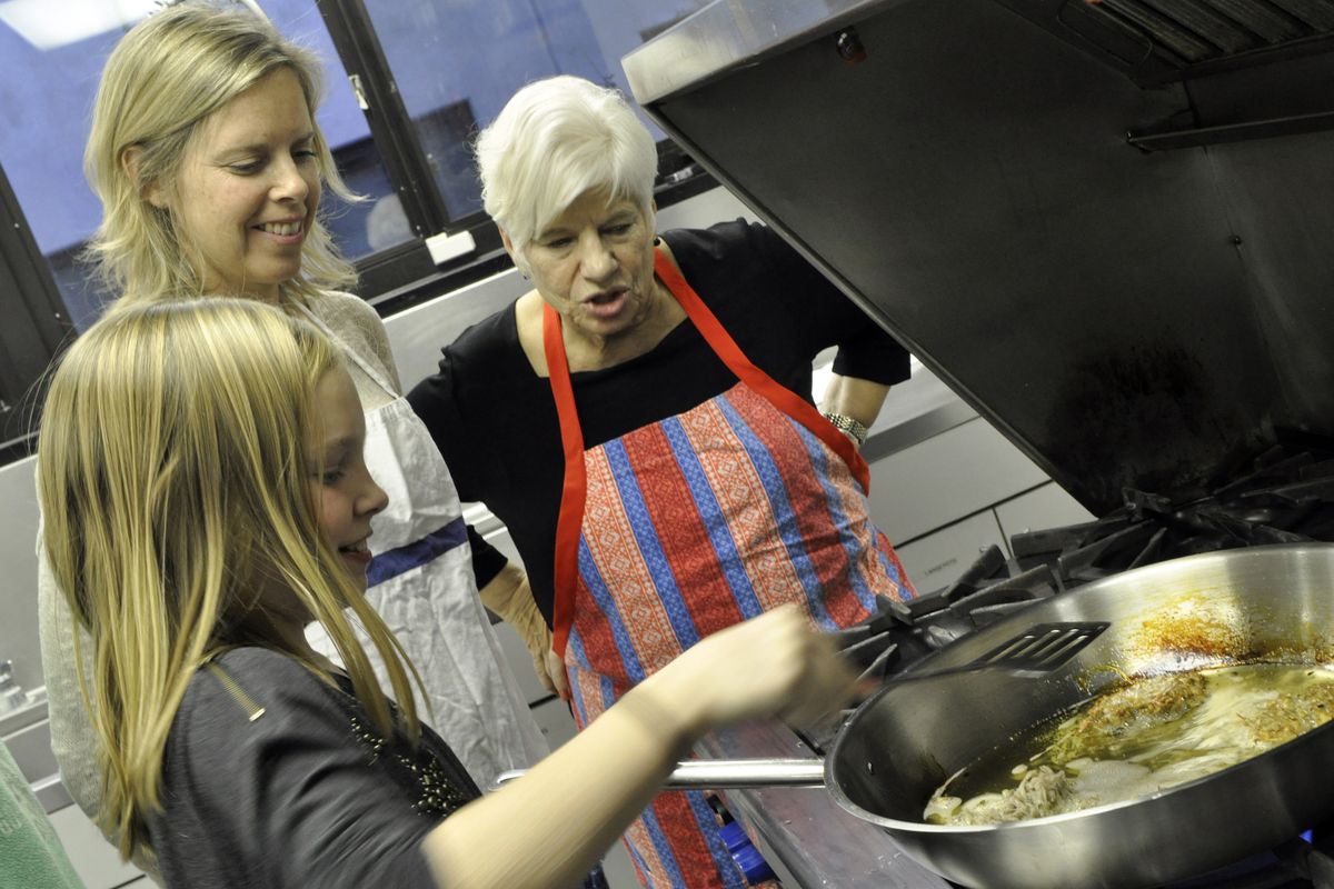 At left: Watching the sizzle of hot oil is a big part of the tradition of preparing latkes made at Temple Beth Shalom.