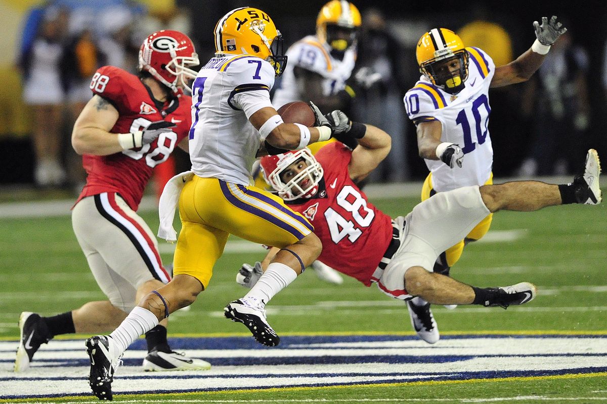 LSU’s Tyrann Mathieu (7) returns a punt for a TD during the first half of the Tigers’ 42-10 win over Georgia in the SEC title game. (Associated Press)