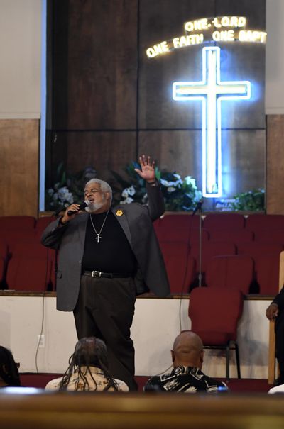 New Bethel Missionary Baptist Church Pastor Robert Smith Jr. sings at the beginning of a prayer vigil for Aretha Franklin, Wednesday, Aug. 15, 2018 in Detroit. People are praying for Franklin in the Detroit church where her father was once a pastor. (Jose Juarez / Detroit News)