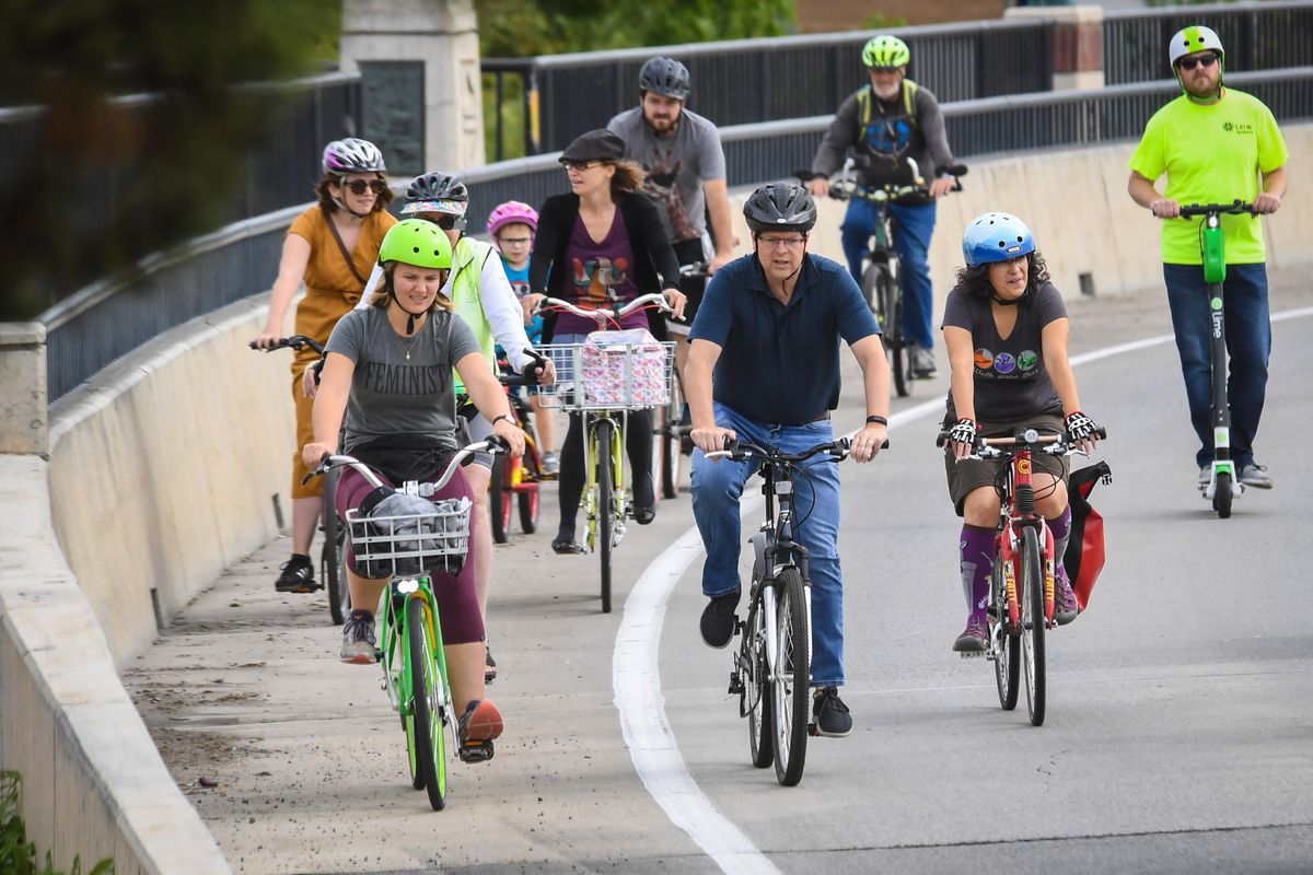 Spokane City Councilman Breean Beggs, center, leads the last group of riders westbound on Spokane Fall  Boulevard in the University District on Saturday, Sept. 14, 2019. The route will be a temporary pop-up protected bike lane. Beggs,  Councilwoman Kate Burke and state Senate Majority Leader Andy Billig conducted a cycling town hall meeting and then rode a course around the area. (Dan Pelle / The Spokesman-Review)