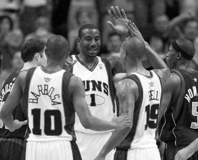Phoenix Suns' Amare Stoudemire (1) celebrates with teammates in a win over the Dallas Mavericks.
(Associated Press / The Spokesman-Review)