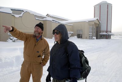 Spokane County Fair and Expo Center worker Craig Crocker  explains to Lee Ann Thompson that the Christmas Bureau is closed Friday.  (Jesse Tinsley / The Spokesman-Review)