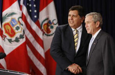 
President Bush shakes hands with Peru's President Alan Garcia prior to signing the U.S.-Peru Trade Promotion Agreement Implementation Act on Friday. Associated Press
 (Associated Press / The Spokesman-Review)