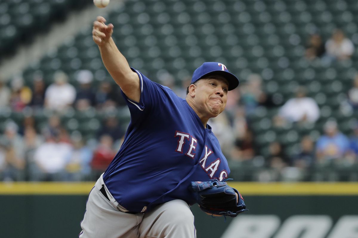 Texas Rangers starting pitcher Bartolo Colon throws against the Seattle Mariners during the first inning of a baseball game, Wednesday, May 16, 2018, in Seattle. (Ted S. Warren / AP)