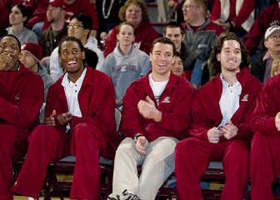 
Kyle Weaver, left, and Derrick Low are seen on opposite sides of WSU head coach Tony Bennett. Weaver and Low are the first WSU players chosen to play in the Pan Am Games.Associated Press
 (Associated Press / The Spokesman-Review)