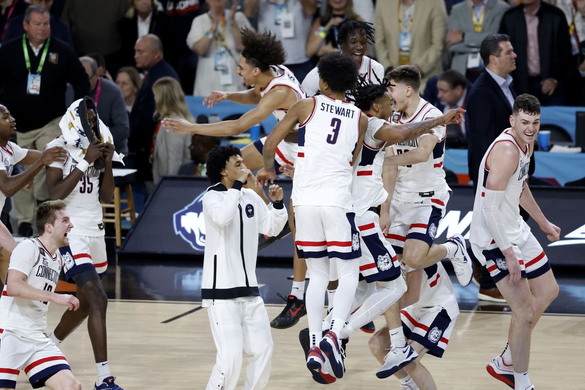 The Connecticut Huskies celebrate after beating the Purdue Boilermakers 75-60 to win the NCAA Men