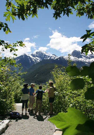 
Associated Press Hikers on a trail from North Cascades Institute's Environmental Learning Center take in the North Cascades vistas, including Pyramid and Colonial mountains on Diablo Lake, Wash. The free day hikes and canoe trips offered at the North Cascades Institute's gorgeous environmental learning center provide a fascinating introduction not only to the stunning sights of the surrounding 684,000-acre national park, but also to its priceless human and natural history.
 (Associated Press / The Spokesman-Review)