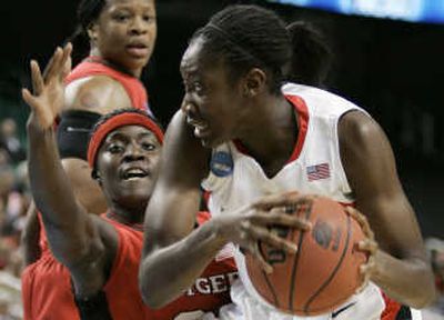 
Rutgers' Matee Ajavon hassles Connecticut's Tina Charles, right. Associated Press
 (Associated Press / The Spokesman-Review)