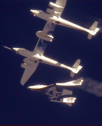 In this photo released by Virgin Galactic, the Virgin Galactic SpaceShipTwo, or VSS Enterprise, is released from the mothership, WhiteKnight2, also known as VMS Eve, over the Mojave, Calif., area early Sunday, Oct. 10, 2010. (Mark Greenberg / AP)