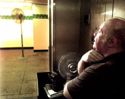 
You don't want to be sweating out the heat the way this New York City elevator operator was last summer. By acting now, you'll be able to hire a person to service your unit — unlike during the summer heat when they are so busy that you may have to wait several days. 
 (File Photo / The Spokesman-Review)