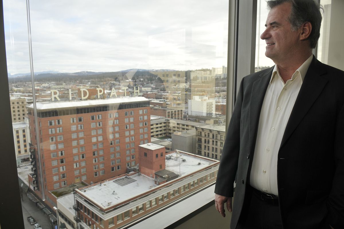 Art Coffey looks out at the Ridpath Hotel on Thursday. He wants to revive the hotel, visible from his Bank of America Center office. (Jesse Tinsley)