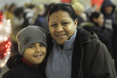 Maria Paz wants her son Alex, 9, to help America when he grows up.  (Dan Pelle / The Spokesman-Review)